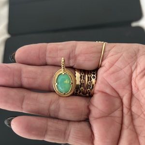 1 pendant, gold fill, no stamp, lovely green colored stone. Good condition.